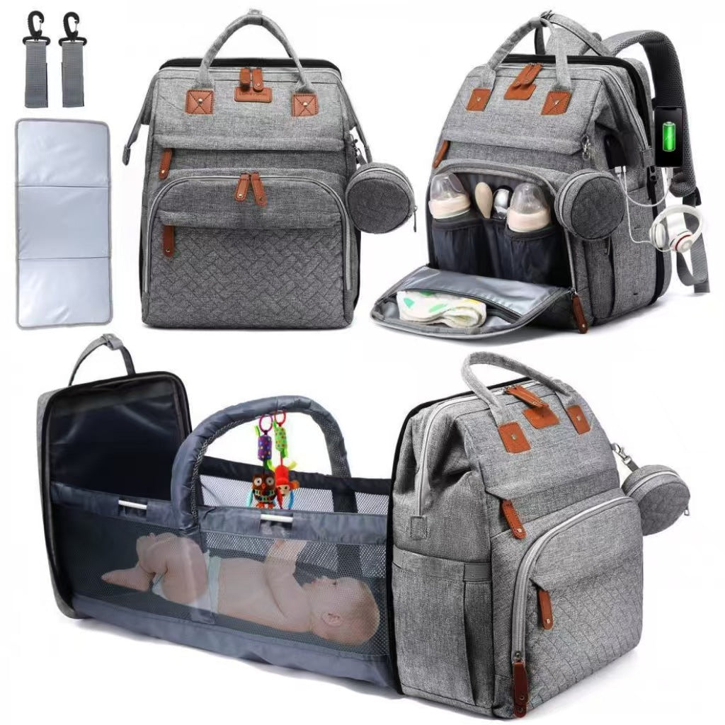 Mommy Backpack with Crib – Large capacity diaper bag featuring foldable crib and anti-mosquito cover.