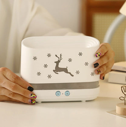 Elk Flame Humidifier & Diffuser Lamp displayed with festive deer design and snowflakes in a cozy setting.