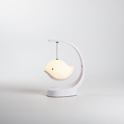 White bird-shaped lamp on a white background